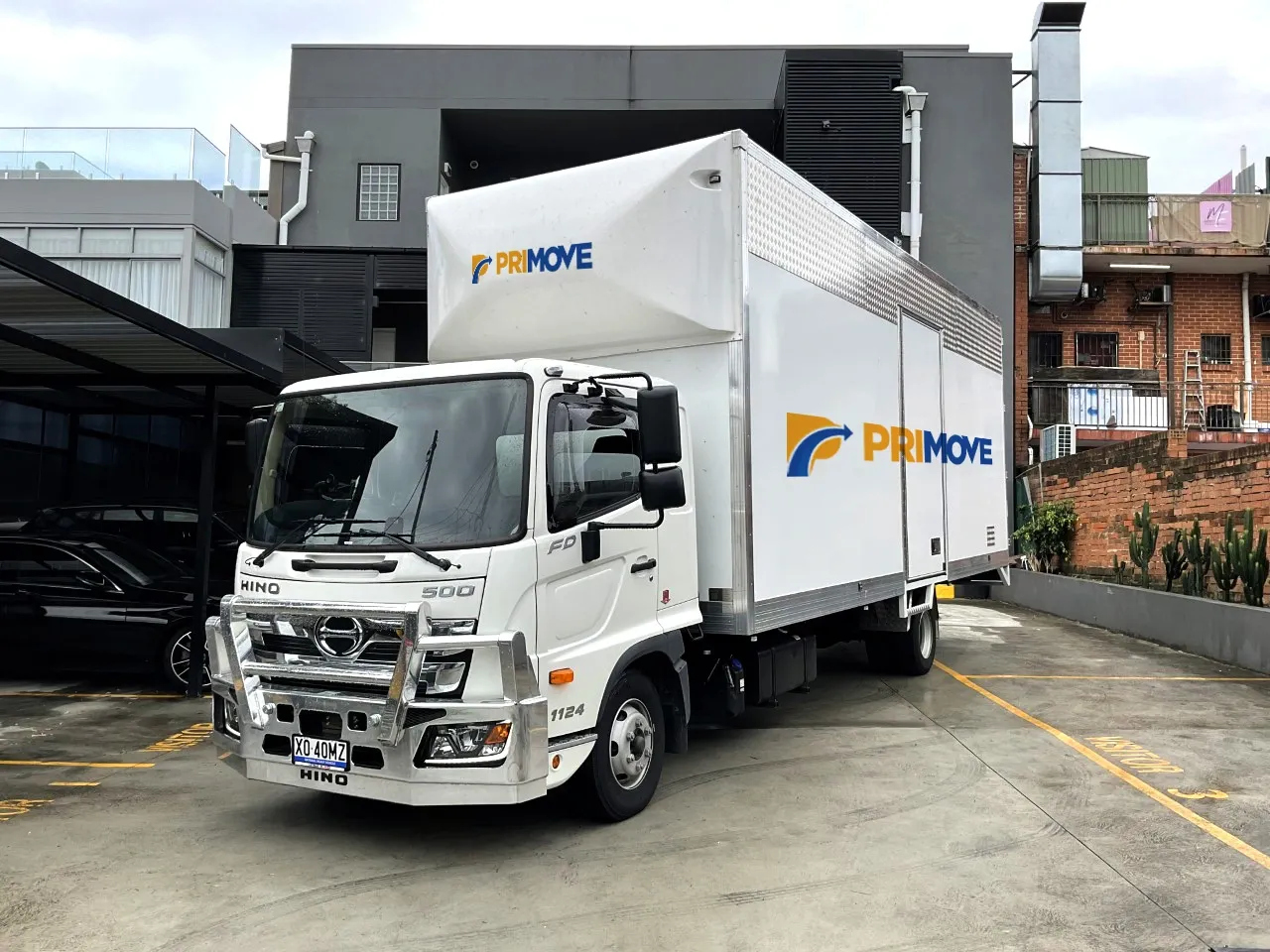 Primove-branded Hino furniture removal truck parked at the depot